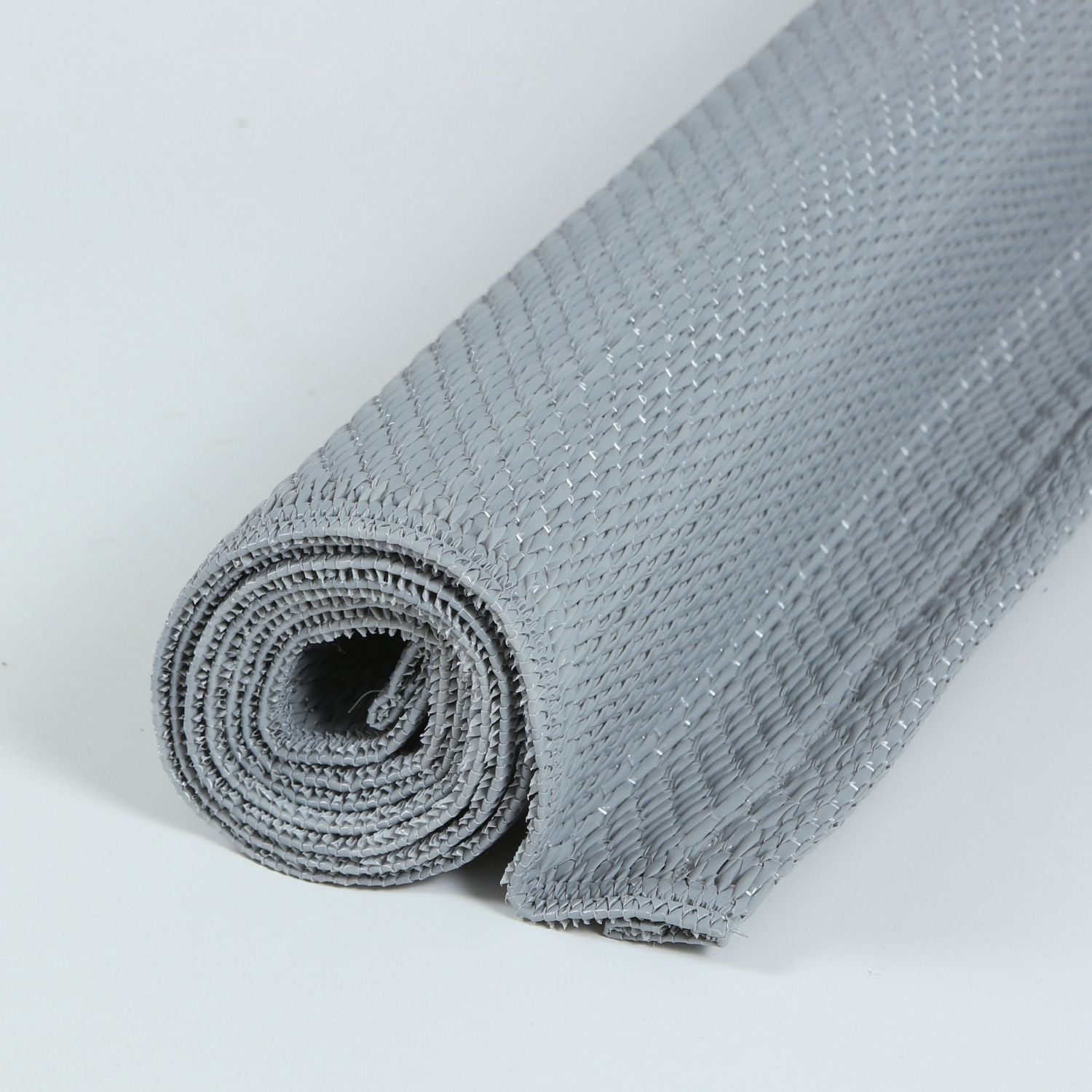 Gray woven urban outdoor rug roll with textured interlaced pattern perfect as an outdoor rug grey option