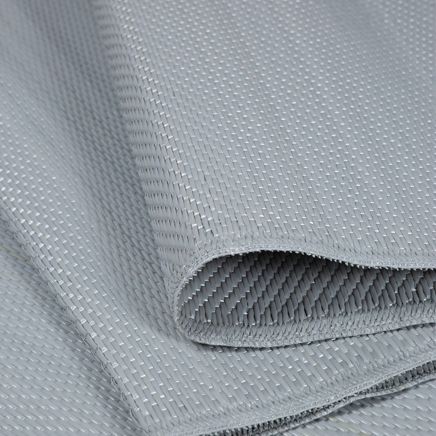 Gray woven urban outdoor rug with tight textured weave and neat edges perfect for outdoor rug grey spaces