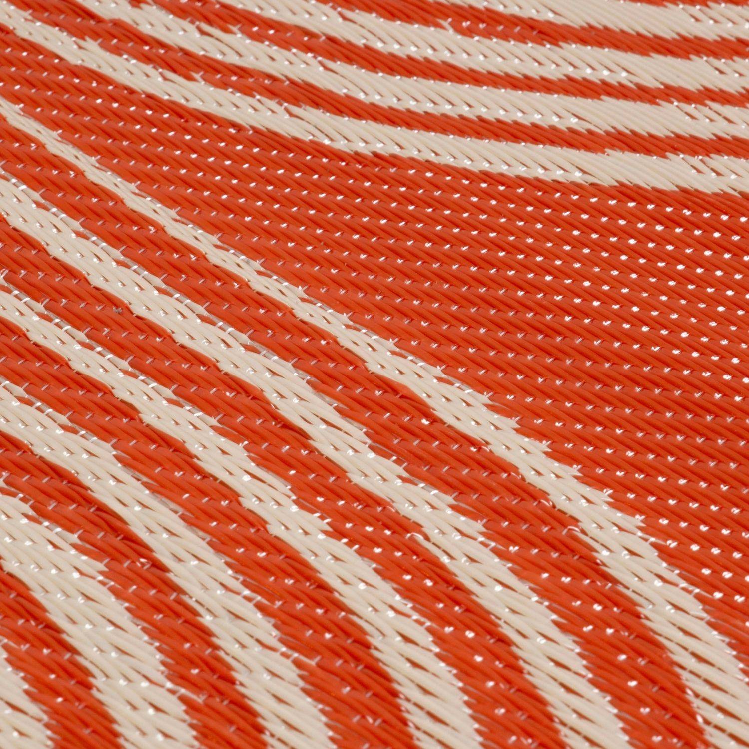 Orange and white diagonally striped woven fabric on an urban outdoor rug terra perfect for outdoor use