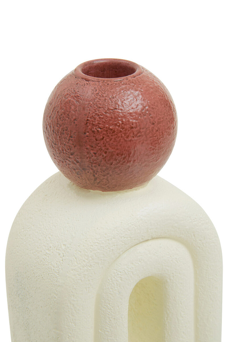 A terracotta utica candle holder with textured spherical vase and cream sculpted base perfect for candles