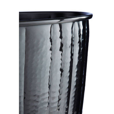 A sleek hammered silver metal bucket with a glossy black nickel finish rim waste bin by vaco