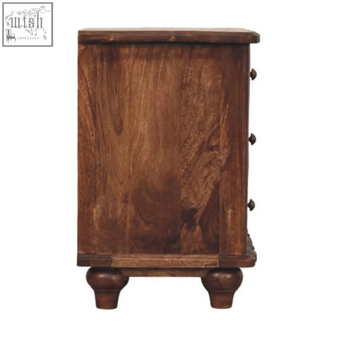 Dark brown valencia bedside table with three drawers and turned legs made from solid mango wood