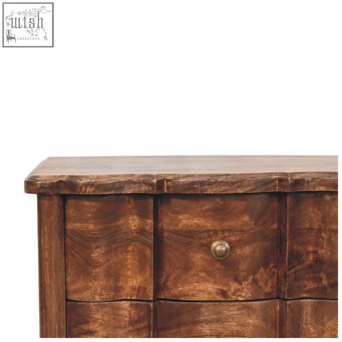 Rustic brown valencia bedside table made of solid mango wood with curved front and a single round brass knob on top drawer