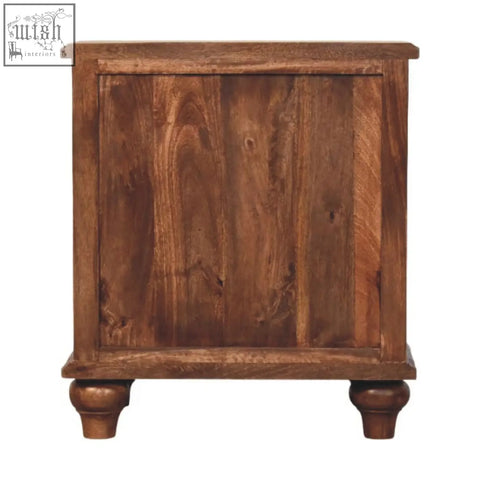 Rustic brown valencia bedside table made of solid mango wood with visible grain and turned legs for bedroom use
