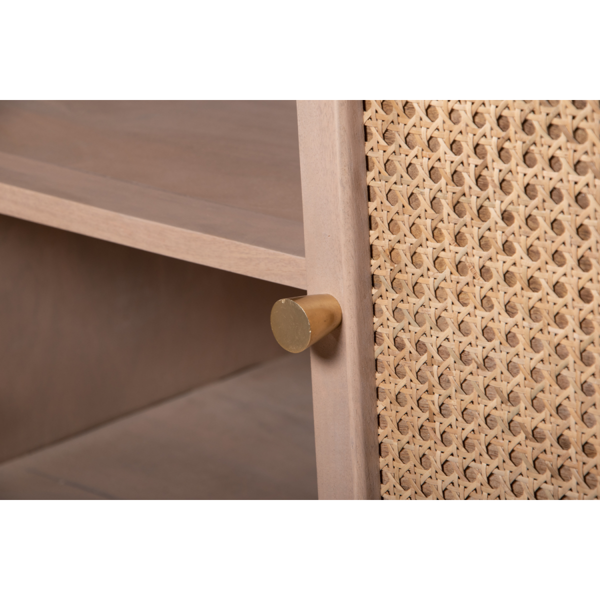 Gold-toned cylindrical drawer pull on valencia cane and mango wood light wood 4 doors sideboard cabinet