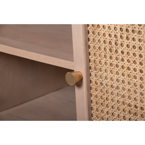 Gold-toned cylindrical drawer pull on valencia cane and mango wood light wood 4 doors sideboard cabinet
