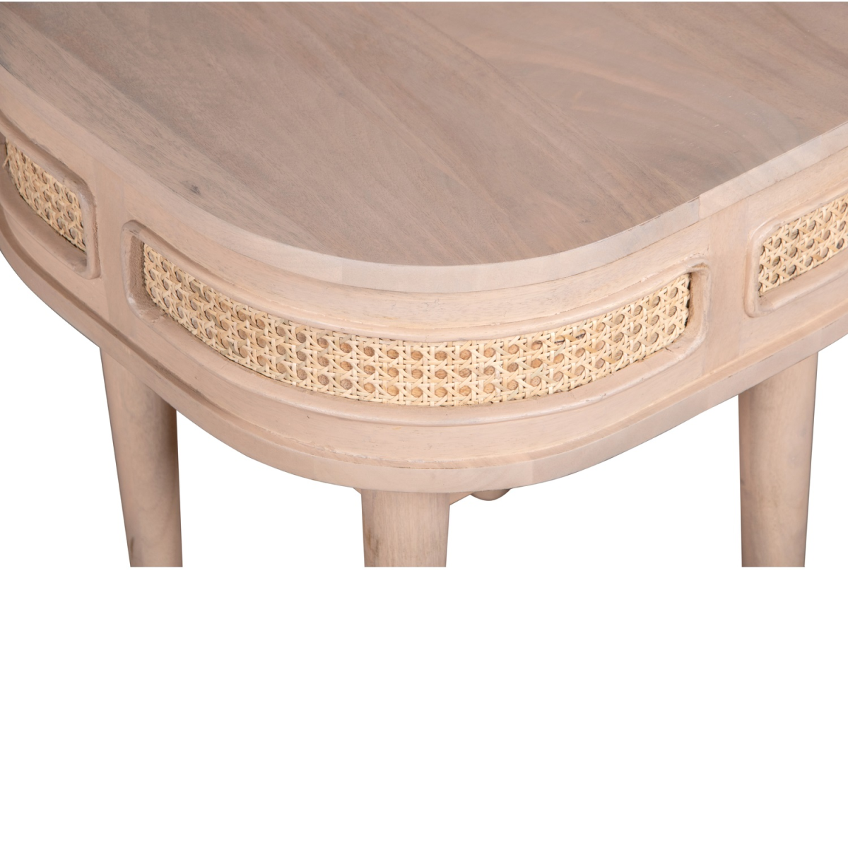 Light-colored mango wood bedside table with valencia cane woven accents along its curved front edge