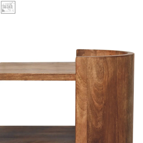 Curved wooden Valencia sculpted bedside table with warm natural finish and visible grain patterns