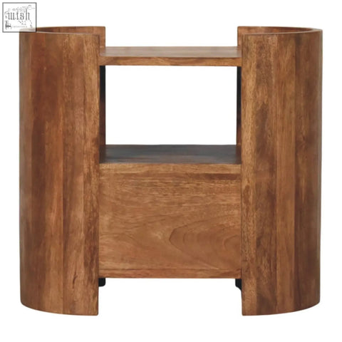 A sleek cylindrical wooden side table with warm brown finish and two open shelves called valencia sculpted bedside