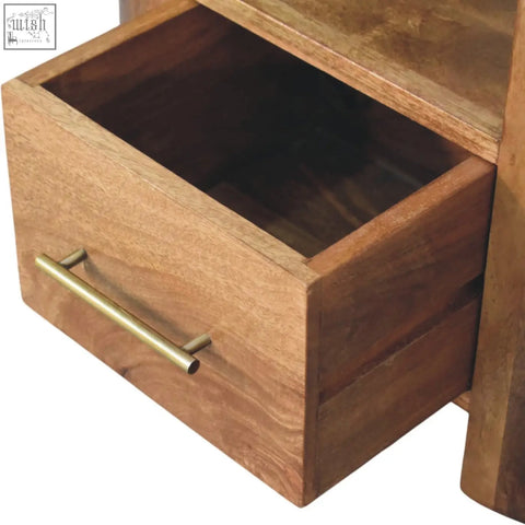 A warm-toned wooden valencia sculpted bedside drawer with sleek brass handle and natural wood grain details