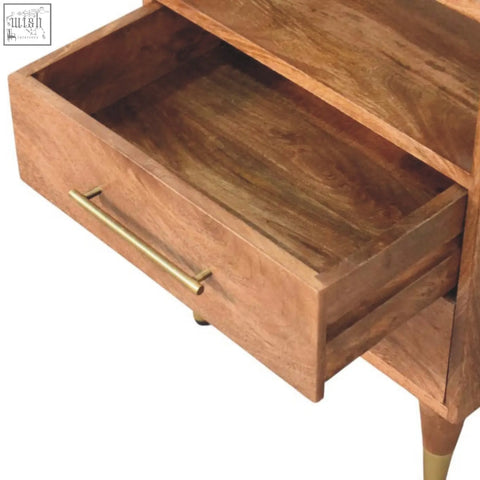 A warm-toned wooden valenza brass accent bedside nightstand with a brass drawer pull and tapered legs