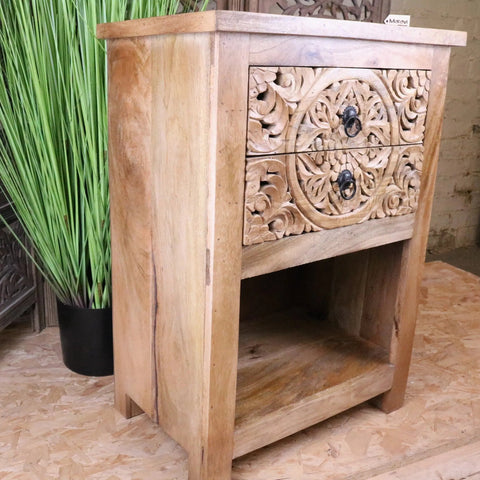 Hand carved light wood vansura carved bedside table with intricate floral patterns and black ring pulls
