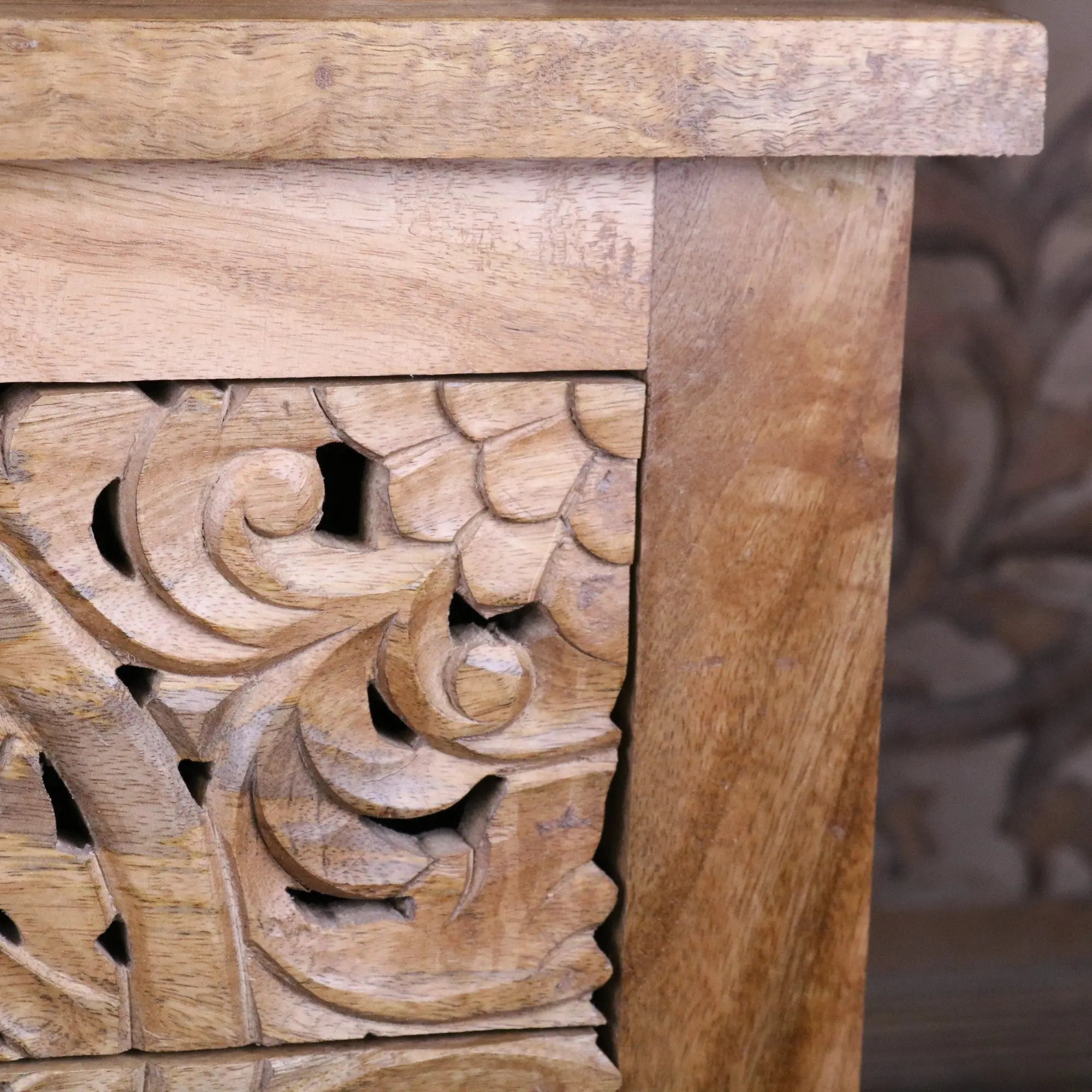 Vansura carved bedside table with hand-carved floral patterns and warm natural wood finish wooden bedside table