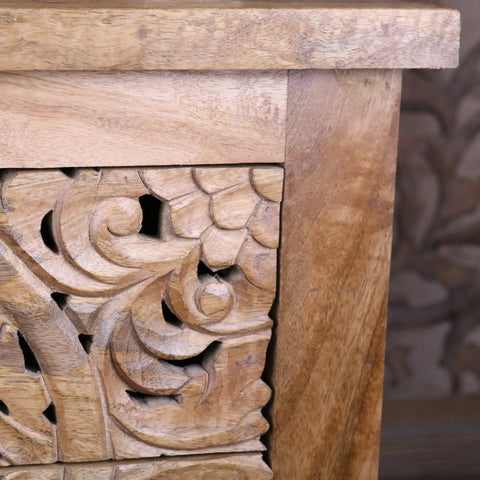 Vansura carved bedside table with hand-carved floral patterns and warm natural wood finish wooden bedside table