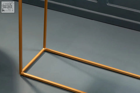 Gold iron frame with clean minimalist geometric design for varana black marble console table top
