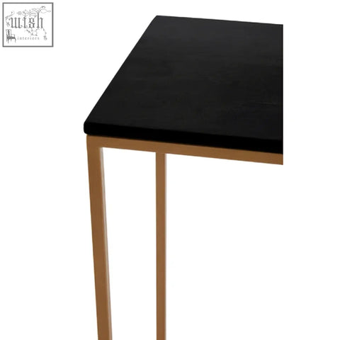 Varana black marble console table with slender gold iron frame legs perfect for stylish entryways or hallways