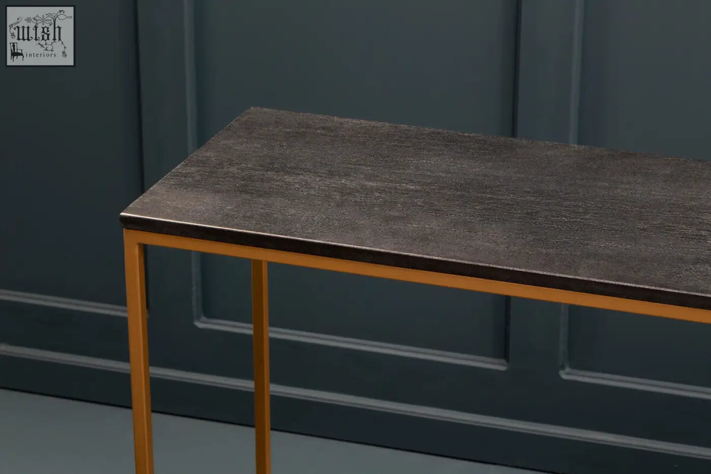 Varana black marble console table with sleek dark gray top and gold iron frame legs for stylish decor