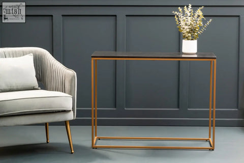 Modern console table with black marble top and gold iron frame featuring a dark matte finish