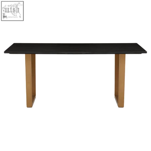 Varana black marble dining table with sleek black marble top and sturdy gold-toned metal legs in a minimalist design