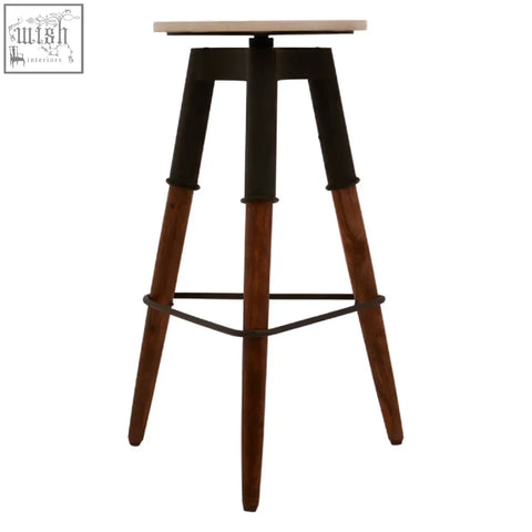 Industrial-style leg bar stool with light wood top black metal frame and dark brown wooden legs perfect for bars