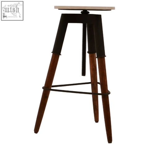 Industrial-style vasco 3 leg bar stool with light wood top black metal frame and adjustable height screw mechanism