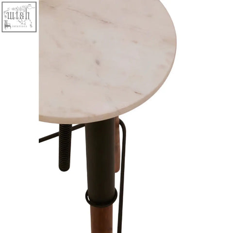 Vasco 3 leg bar stool with a round light beige marble top and sleek black metal base leg bar stool design