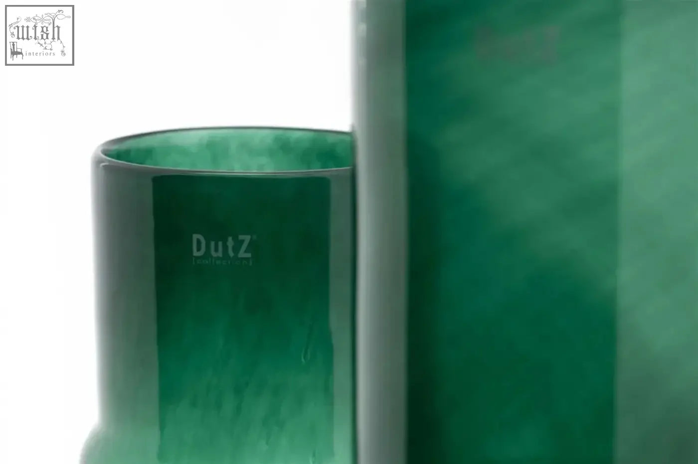 A mouth blown translucent emerald green cylindrical vase from the dutz collection with a glossy finish
