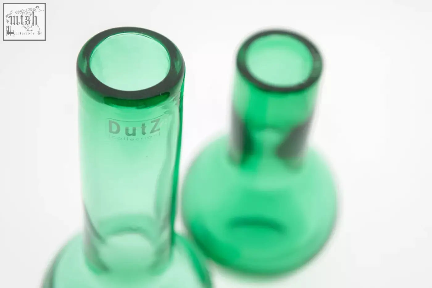 Green glass vases from dutz collection with sleek cylindrical design made of mouth blown glass in jungle green color