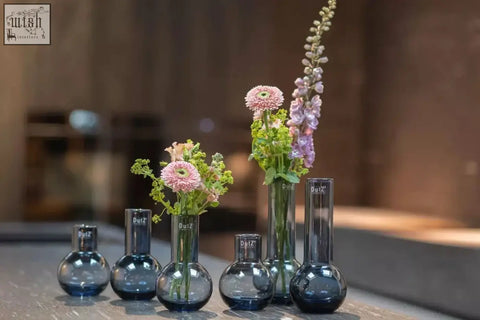 Blue glass vase masa smoke color with rounded base and slender neck mouth blown from dutz collection