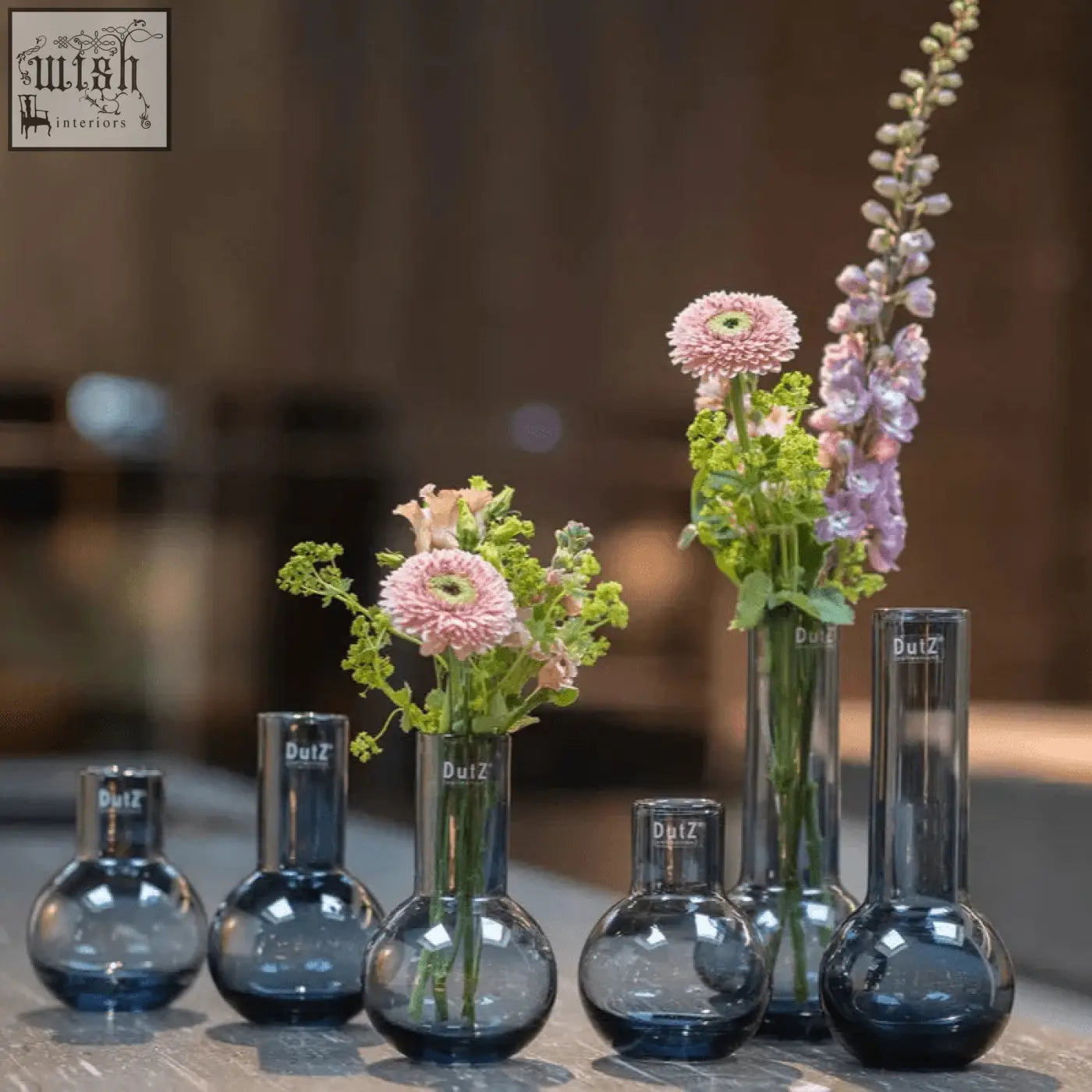 Dark blue mouth blown glass vases from the dutz collection with rounded bottoms and the dutz logo etched on the side