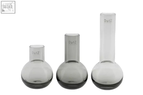 Set of three translucent gray mouth blown glass flasks from the dutz collection with dutz engraved on necks
