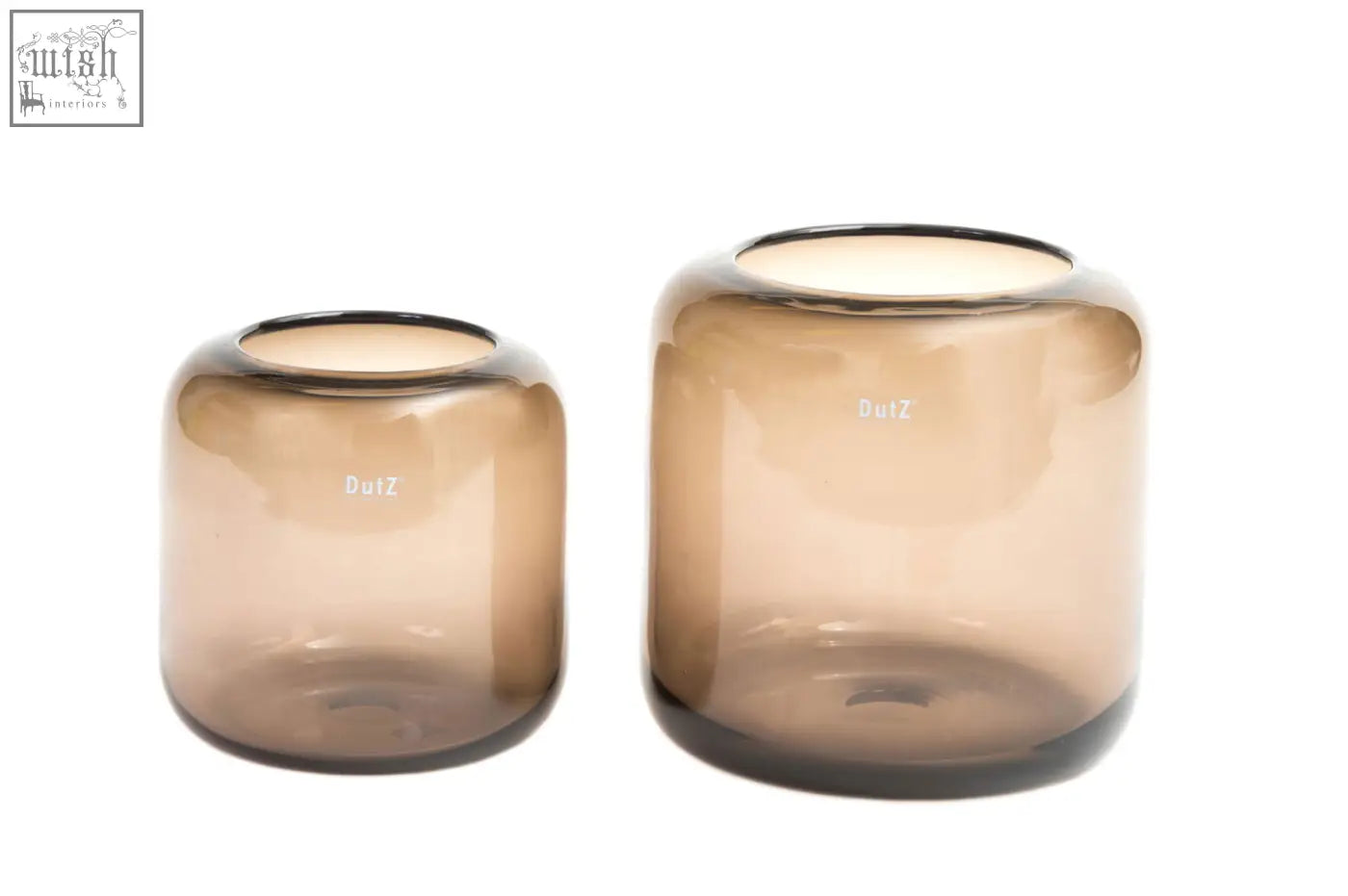 Two mouth blown glass vases in smoky brown from the dutz collection with smooth amber tinted dulz branding