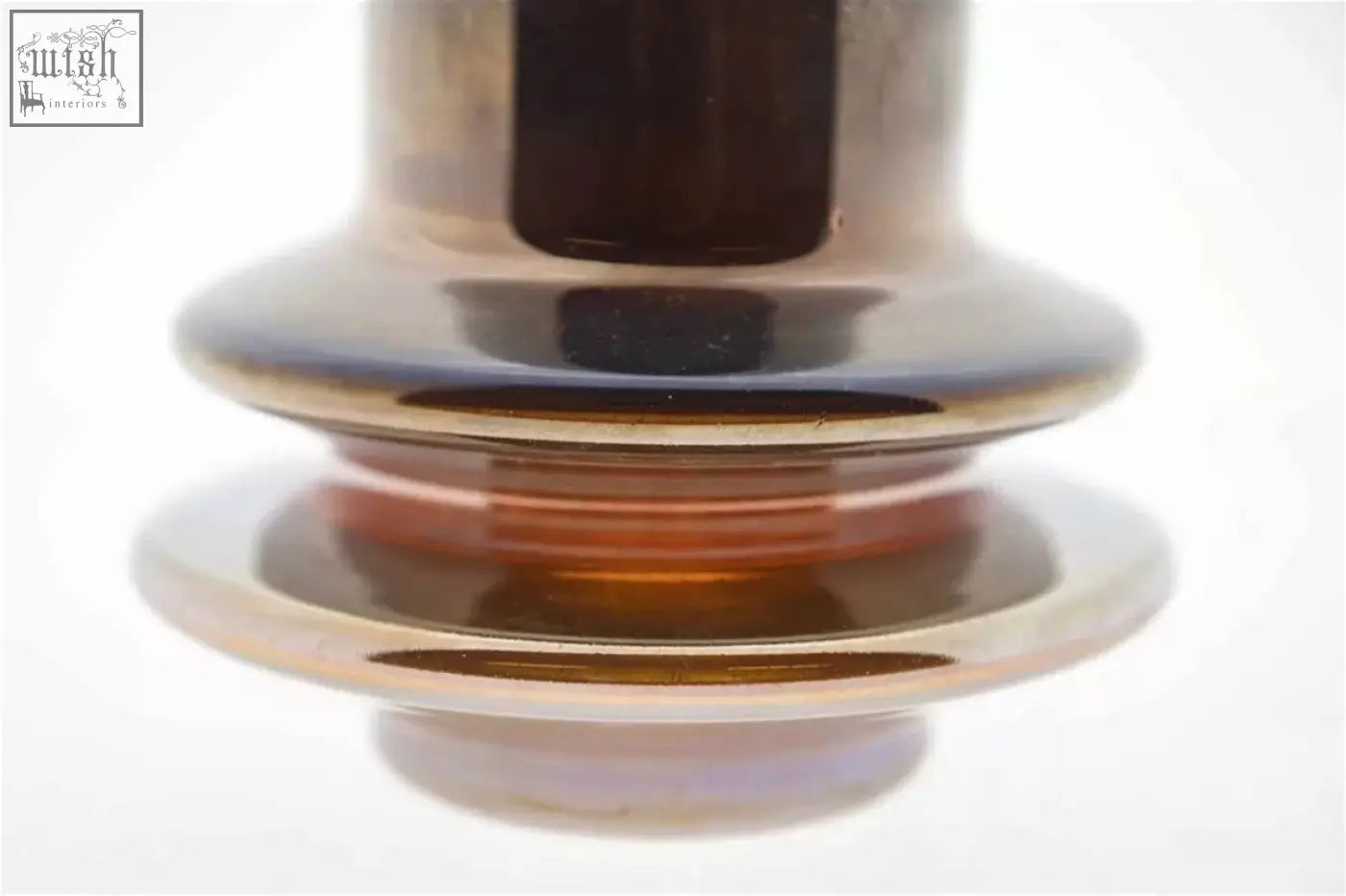 A sleek metallic vase from dutz collection with gold luster finish and layered bands made of mouth blown glass