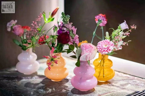 Pastel-colored mouth blown glass vase skrzyszow s orange with stacked bubble design from dutz collection holding flowers