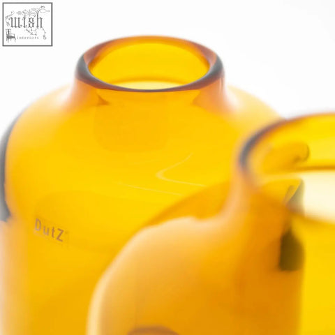 Amber vase tisza mouth blown glass bottle with smooth rounded neck and subtle embossed branding from dutz collection