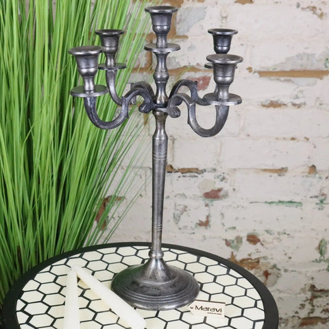 Antique-style veeha candelabra centerpiece with five arms and ornate scrollwork in gunmetal silver finish