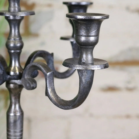 Antique-style veeha candelabra centerpiece with ornate curved arms in gunmetal silver matte finish for five candles