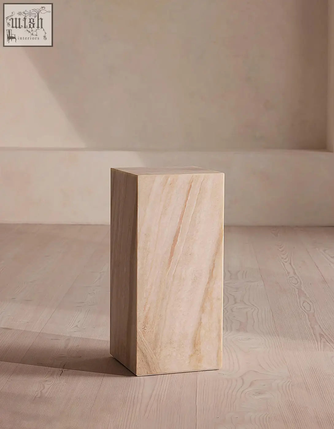 Beige marble plinth with smooth polished surface and subtle veining in minimalist design offer financing available
