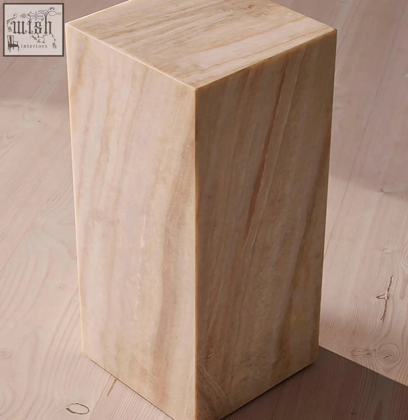 A sleek beige marble plinth with subtle veining in minimalist design perfect as a side table with offer financing