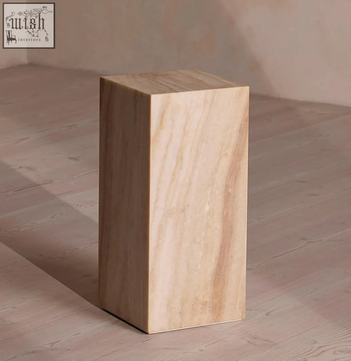 A sleek warm beige marble plinth with subtle veining perfect as a minimalist design side table offering financing options