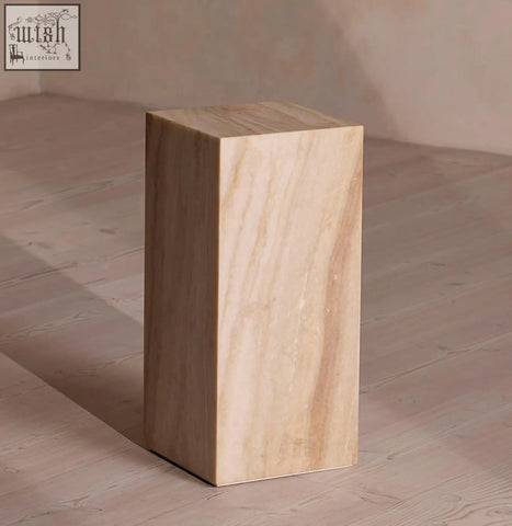 A sleek warm beige marble plinth with subtle veining perfect as a minimalist design side table offering financing options