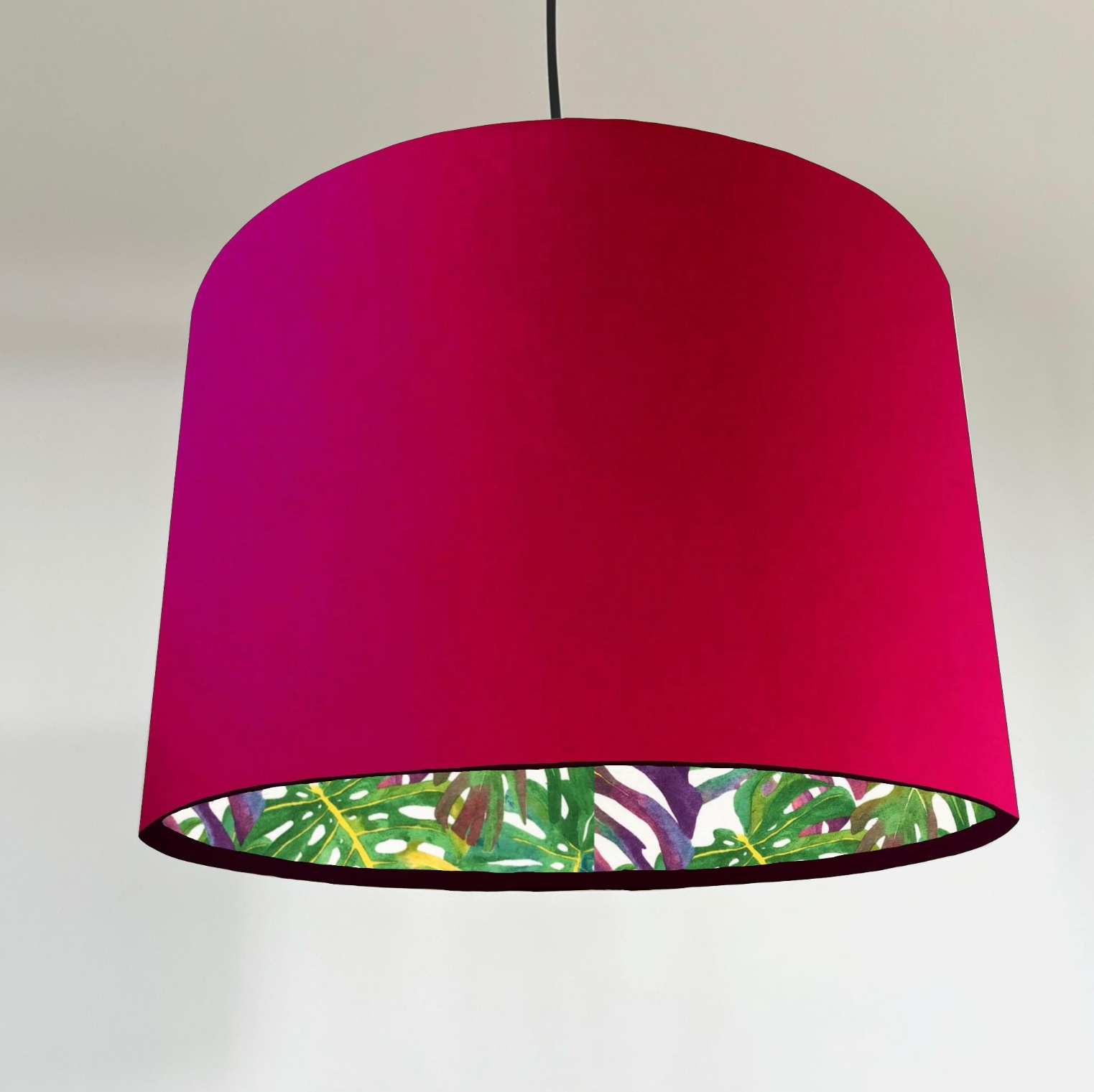 Vibrant fuchsia double sided drum lampshade with tropical leaf pattern lining for ceiling light shade by Velvet UK