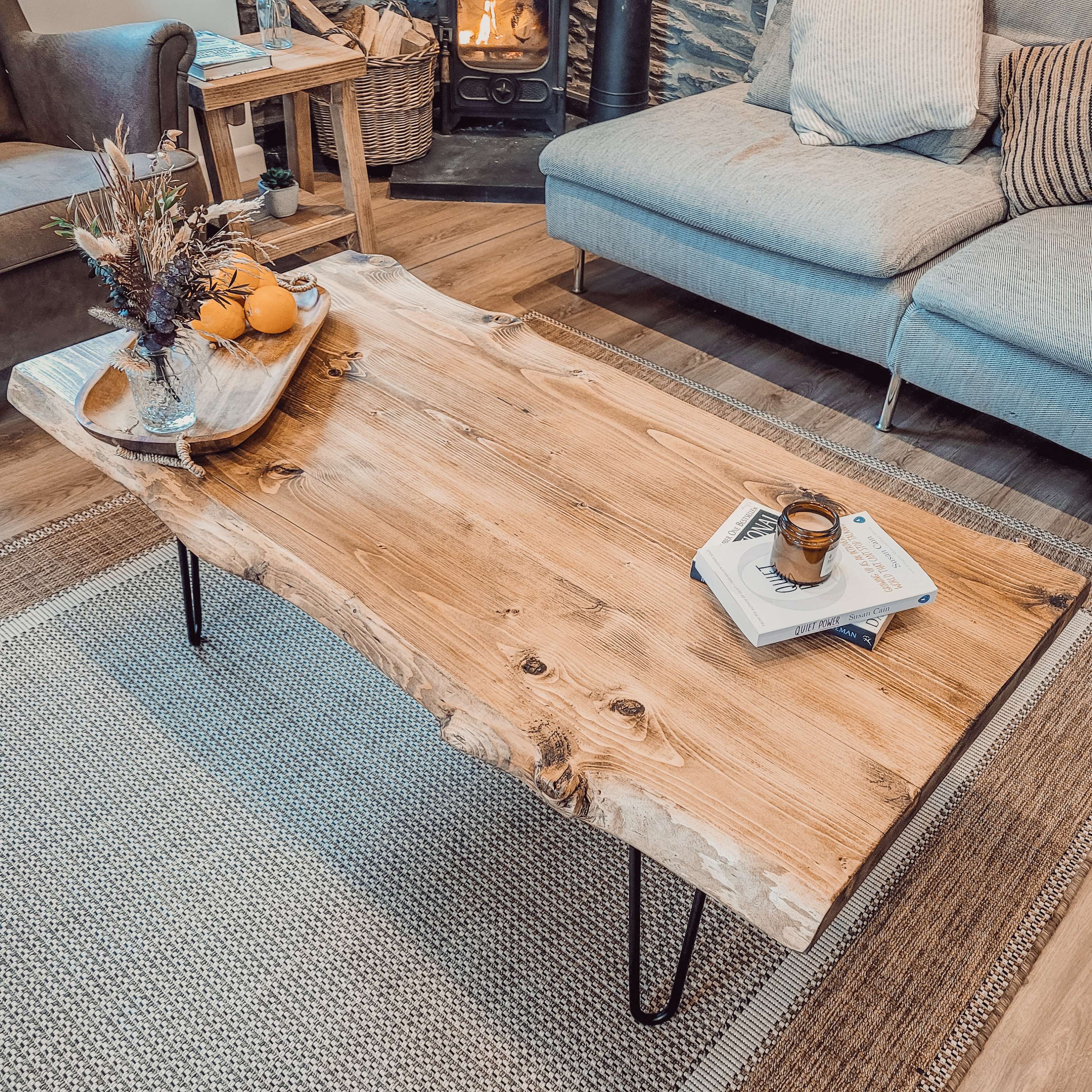 Rustic light brown live edge coffee table with black hairpin legs perfect for stylish living spaces