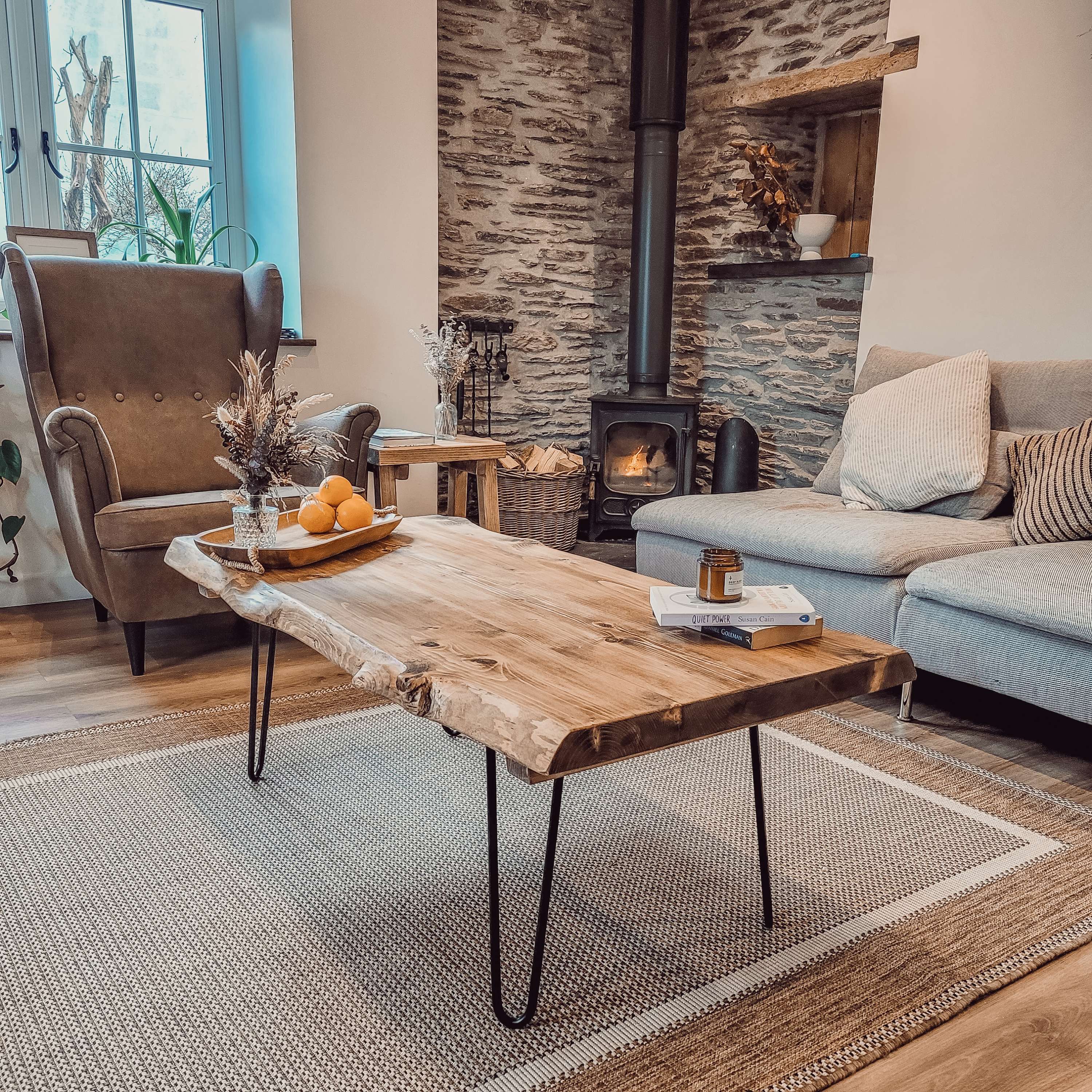 Rustic vene live waney edge coffee table with black hairpin legs made of wood as an edge coffee table centerpiece
