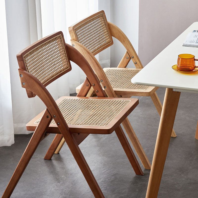 Light brown vera foldable rattan dining chair with woven cane seat and backrest made of rubber wood