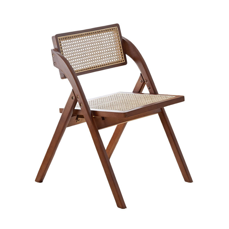 A sleek dark brown vera foldable rattan dining chair made of rubber wood with woven cane seat and backrest