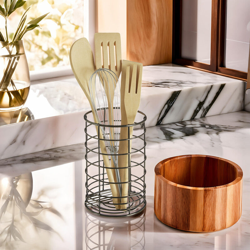 Vertex black nickel finish utensil holder made of metal wire holds wooden spoons and a whisk in a cylindrical design