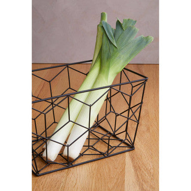 Black wire geometric vertex contour storage basket holding two fresh leeks for kitchen organization