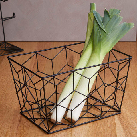 Black wire geometric vertex contour storage basket holding two leeks for kitchen organization