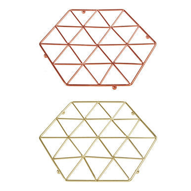 Two hexagonal vertex copper finish wire trivets in rose gold and brass with a geometric triangular grid design